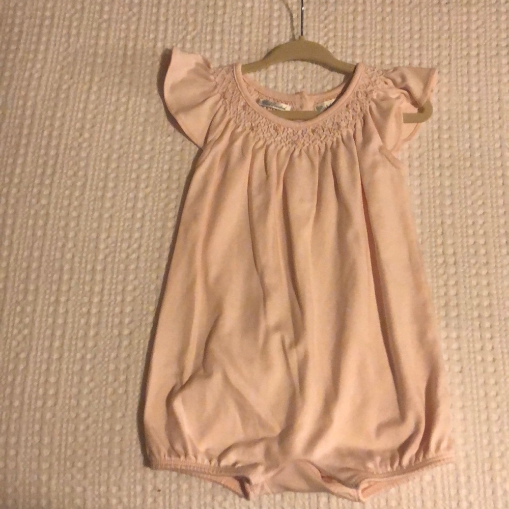 One light pink romper and one white romper